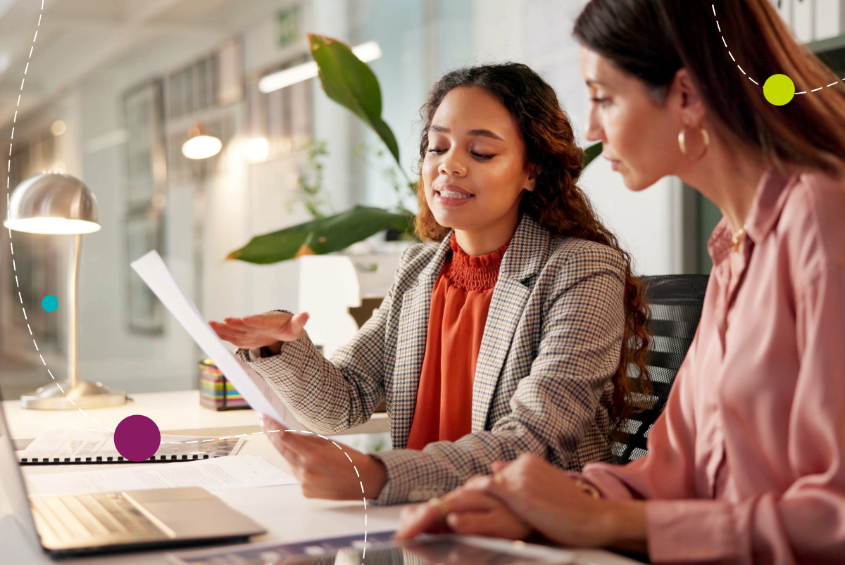 Two women working on a laptop