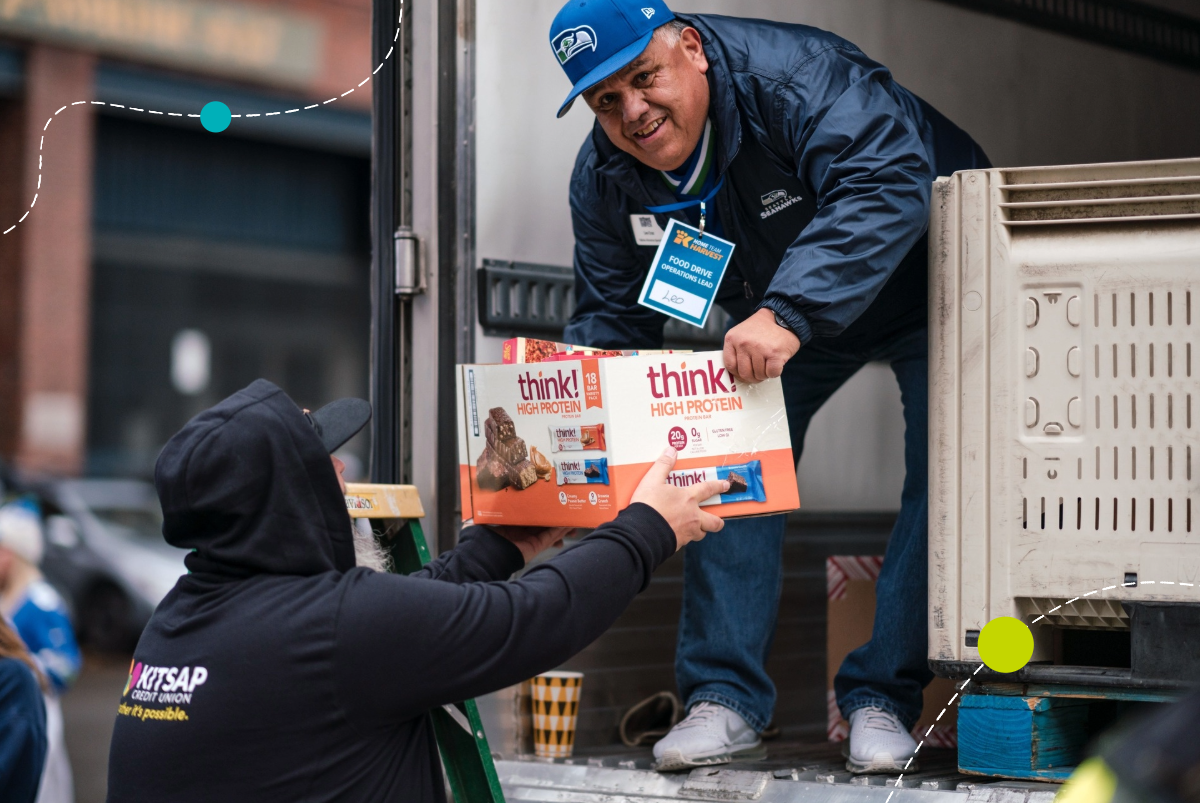 Kitsap Credit Union employee loads truck with food